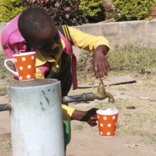 A learner at Phunekani gets a drink